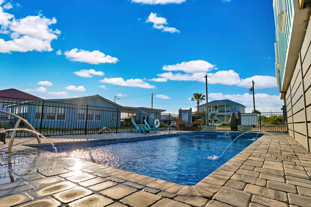 Dog-friendly with Gulf view, pool, balcony, deck, fireplace, central AC, & W&D