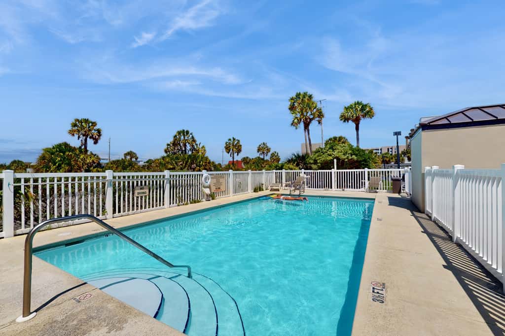 Spacious beachfront condo with full kitchen, shared pool and beach access