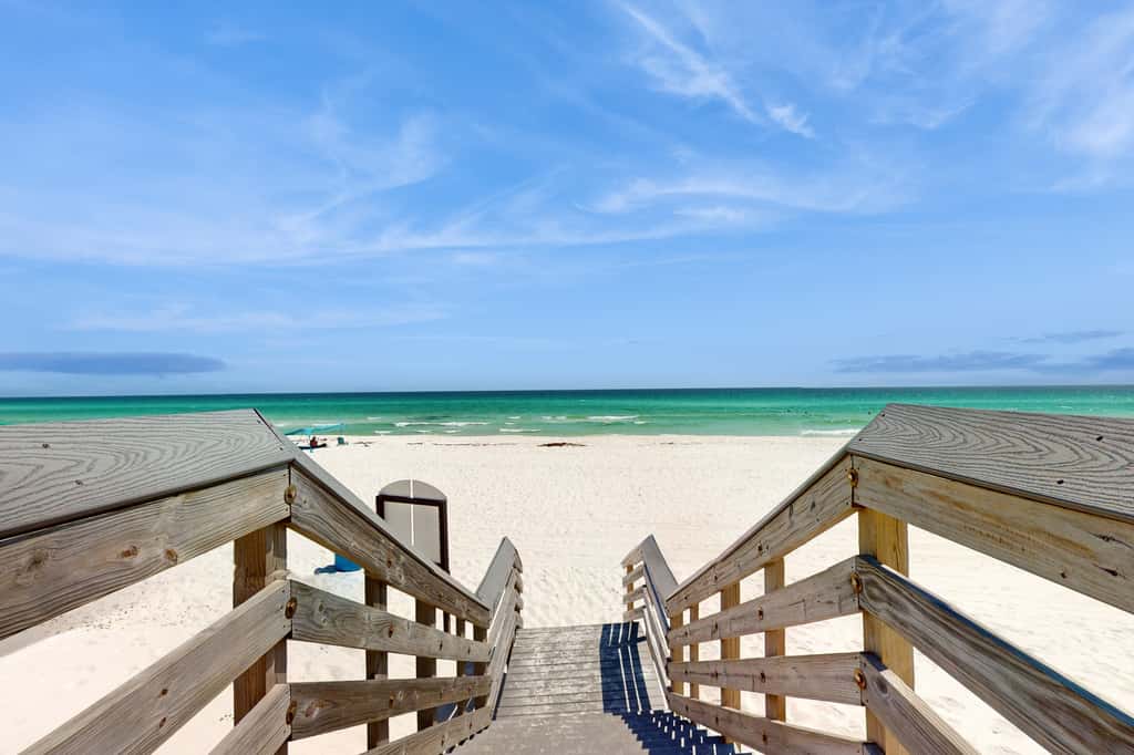 Spacious beachfront condo with full kitchen, shared pool and beach access