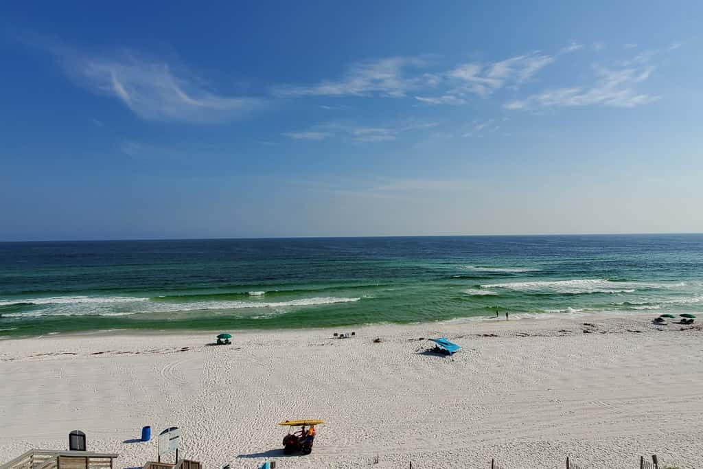 Spacious beachfront condo with full kitchen, shared pool and beach access