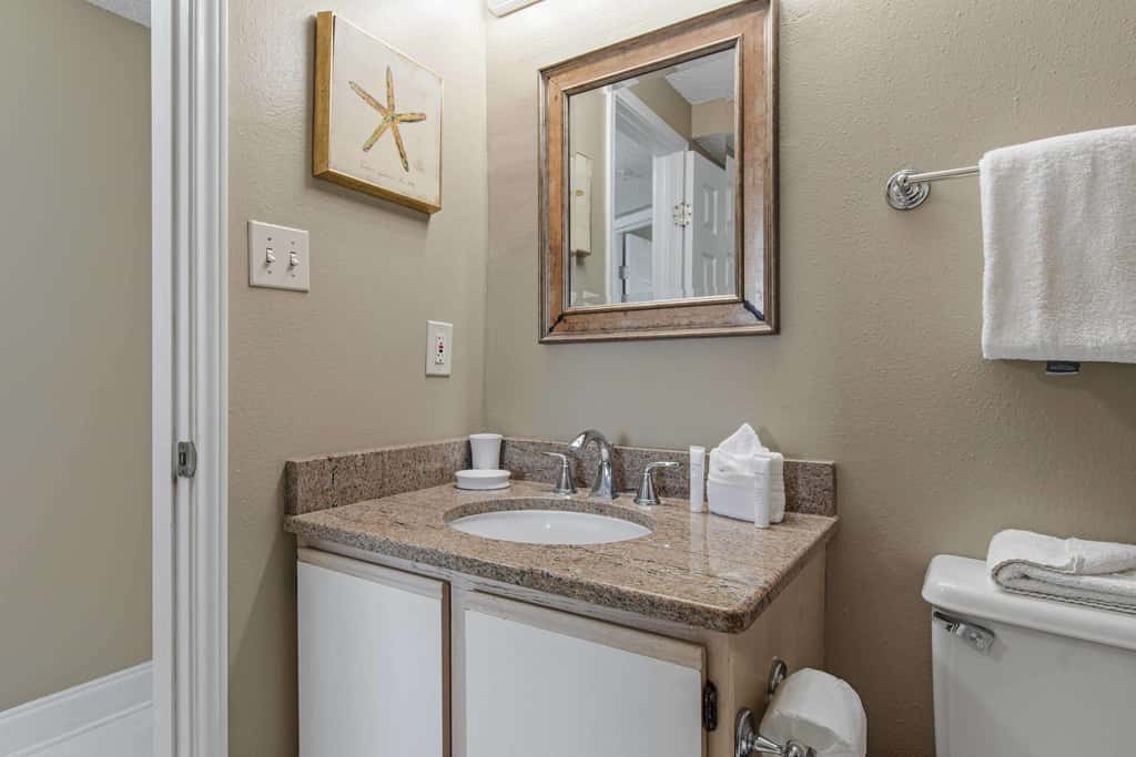Spacious beachfront condo with full kitchen, shared pool and beach access