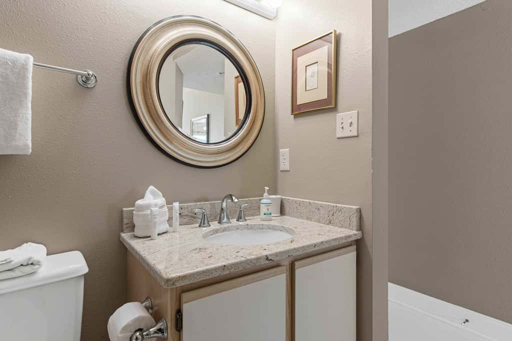 Spacious beachfront condo with full kitchen, shared pool and beach access