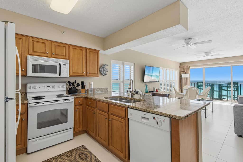 Spacious beachfront condo with full kitchen, shared pool and beach access