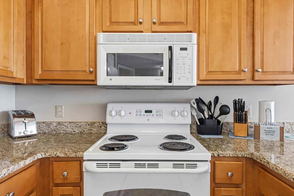 Spacious beachfront condo with full kitchen, shared pool and beach access