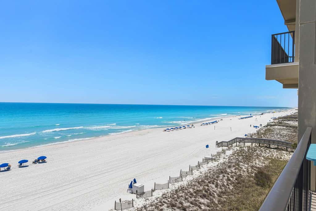 Spacious beachfront condo with full kitchen, shared pool and beach access