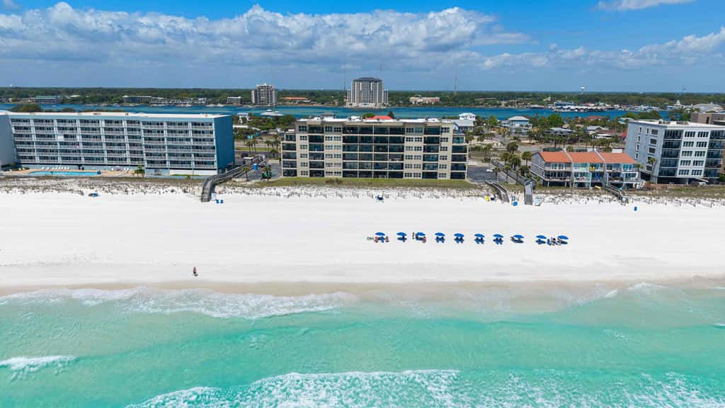 Spacious beachfront condo with full kitchen, shared pool and beach access