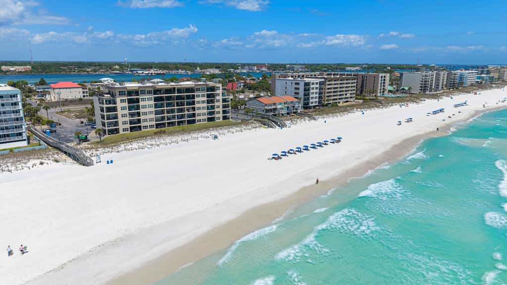 Spacious beachfront condo with full kitchen, shared pool and beach access