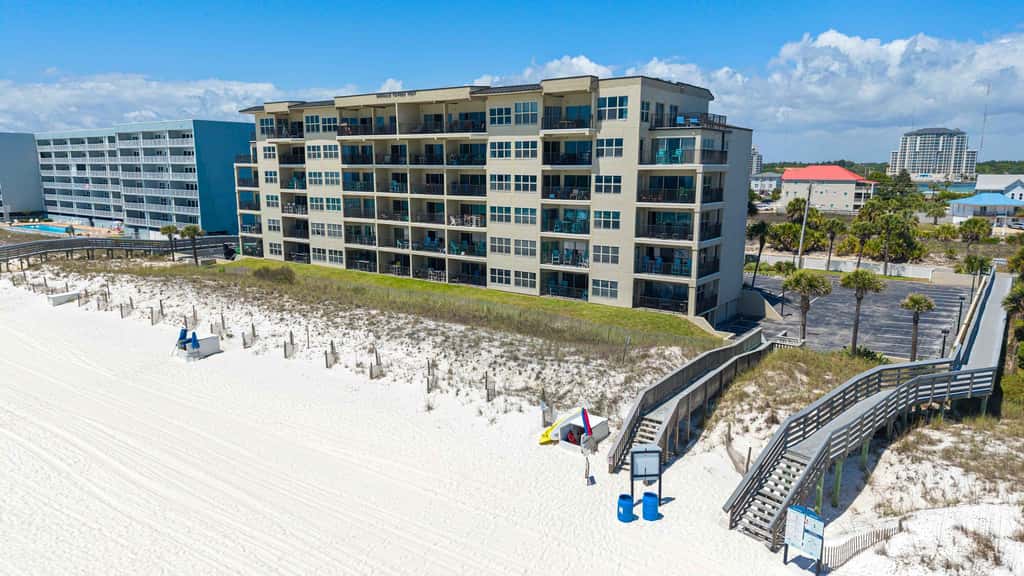 Spacious beachfront condo with full kitchen, shared pool and beach access