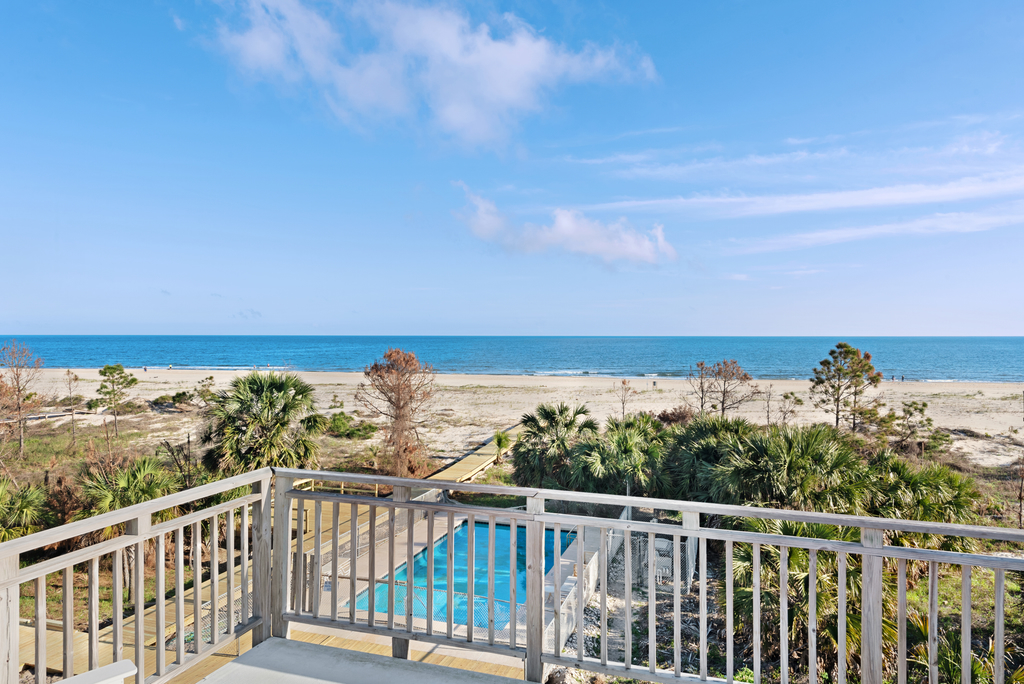 Beachfront home with screened porch with boardwalk access to pool
