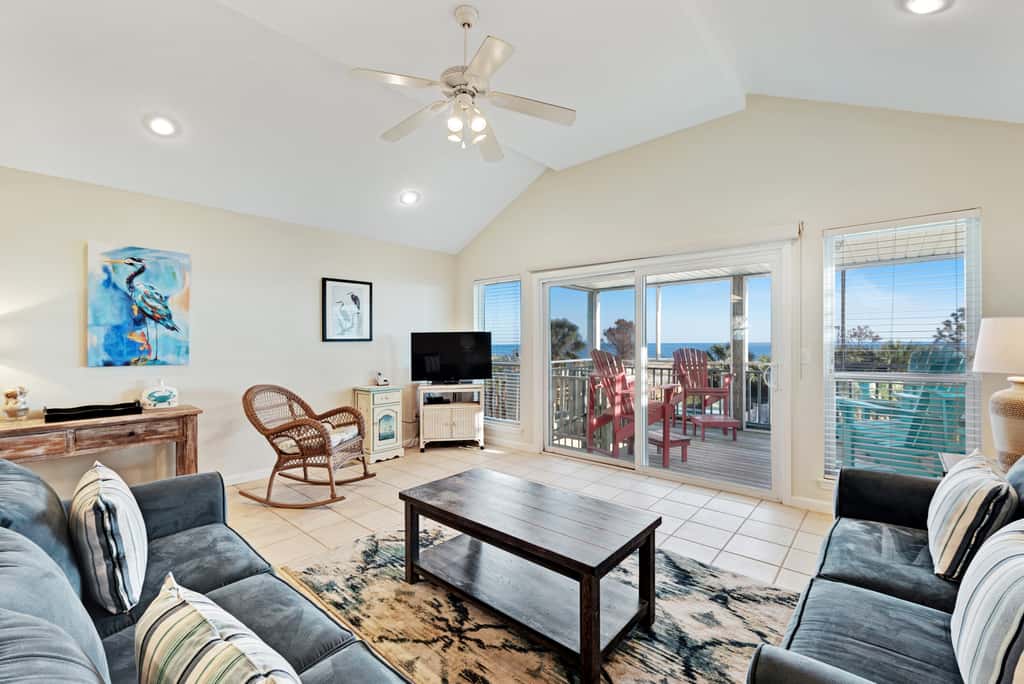 Beachfront home with screened porch with boardwalk access to pool