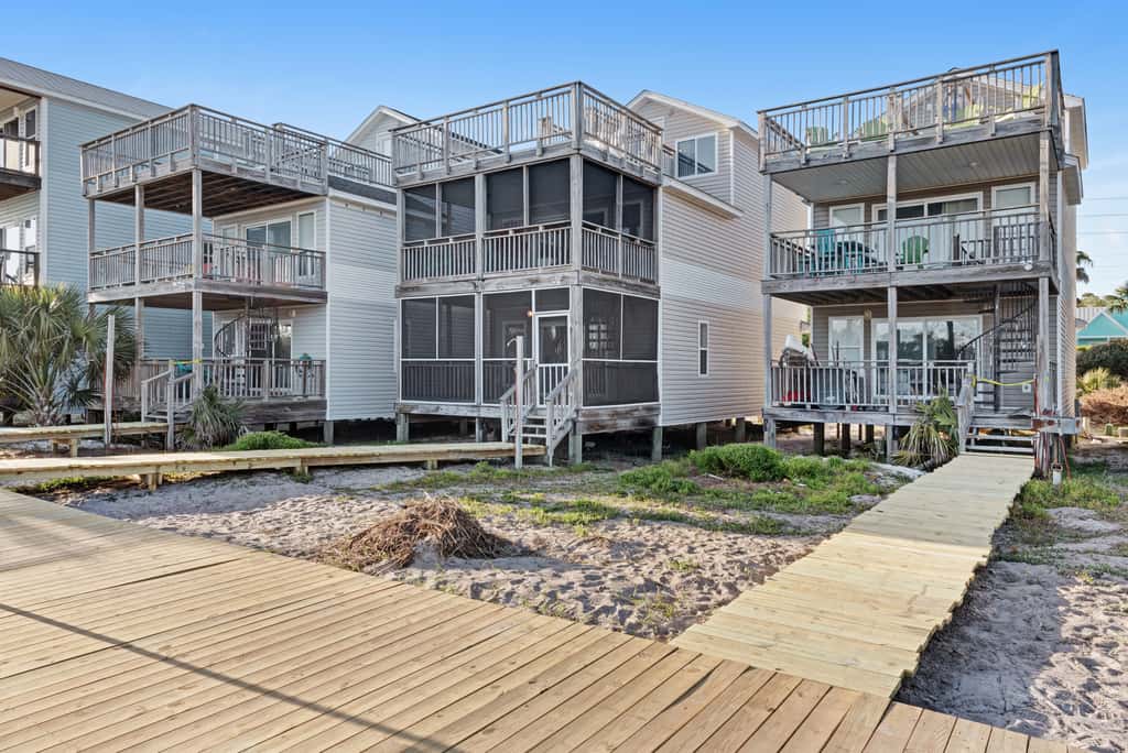 Beachfront home with screened porch with boardwalk access to pool