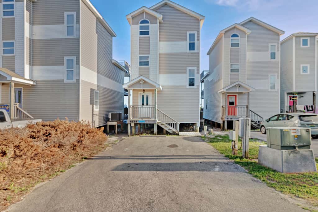 Beachfront home with screened porch with boardwalk access to pool
