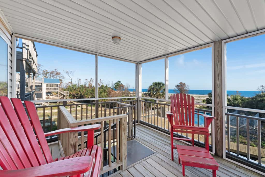 Beachfront home with screened porch with boardwalk access to pool