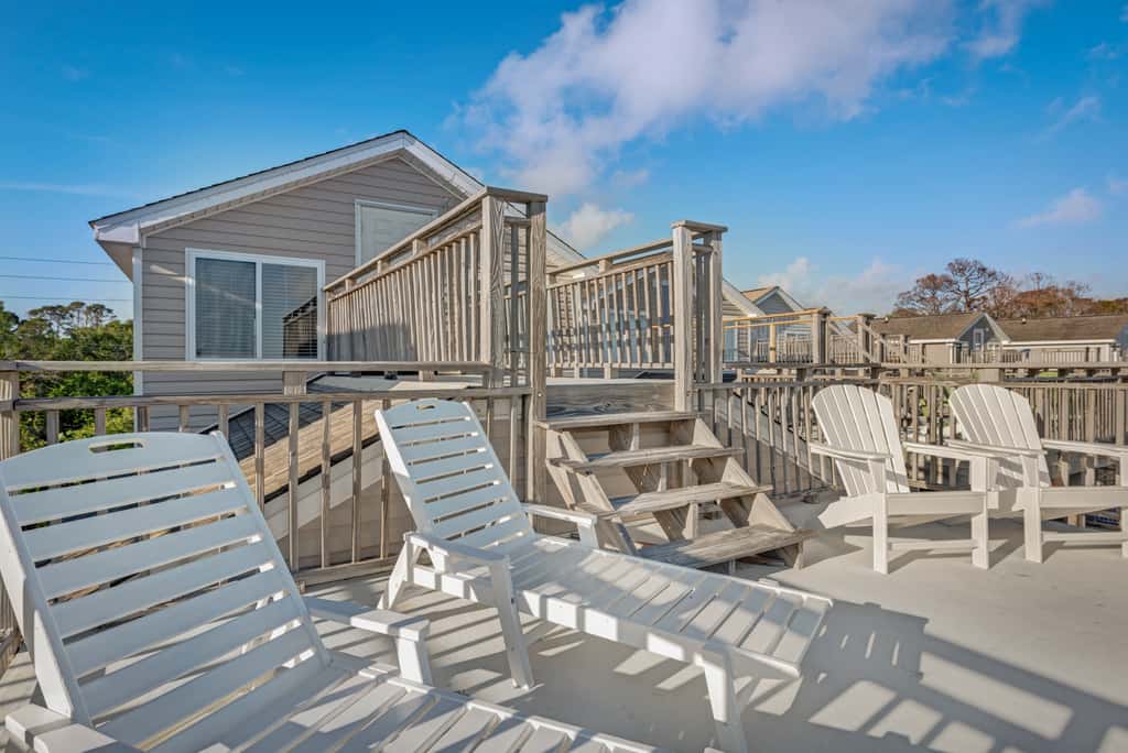 Beachfront home with screened porch with boardwalk access to pool