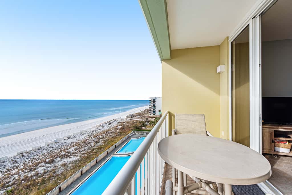 Stunning top-floor condo with balcony, pool, & beach access - great location