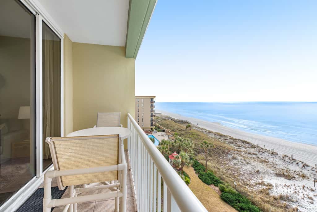 Stunning top-floor condo with balcony, pool, & beach access - great location
