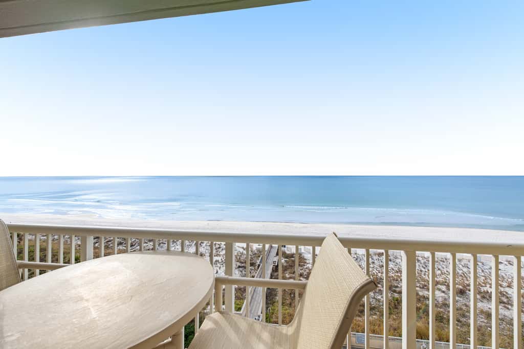 Stunning top-floor condo with balcony, pool, & beach access - great location
