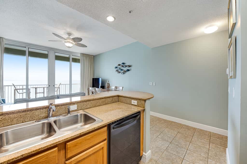 Stunning top-floor condo with balcony, pool, & beach access - great location