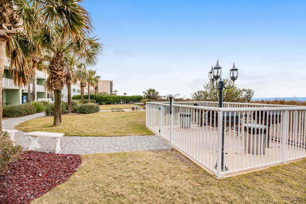 Stunning top-floor condo with balcony, pool, & beach access - great location