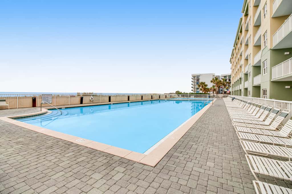 Stunning top-floor condo with balcony, pool, & beach access - great location