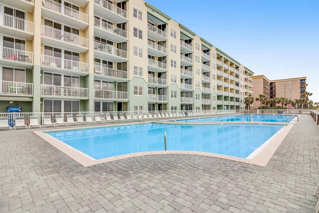 Stunning top-floor condo with balcony, pool, & beach access - great location