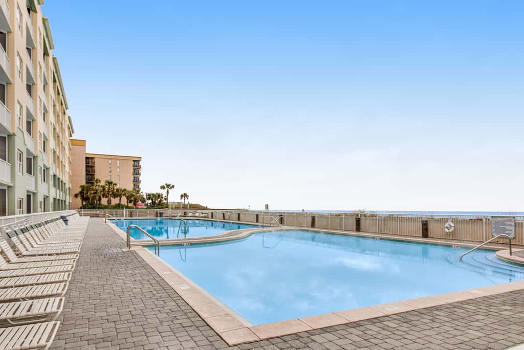 Stunning top-floor condo with balcony, pool, & beach access - great location