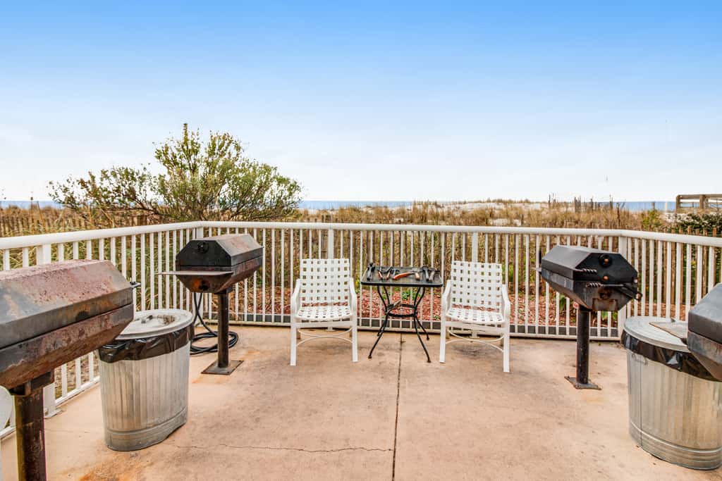 Stunning top-floor condo with balcony, pool, & beach access - great location