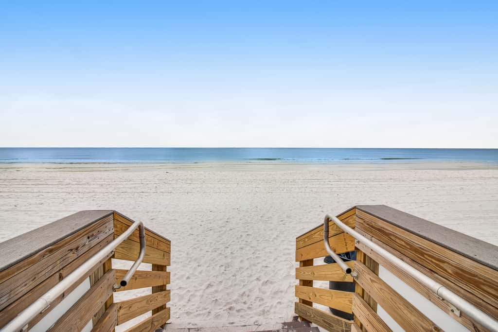 Stunning top-floor condo with balcony, pool, & beach access - great location