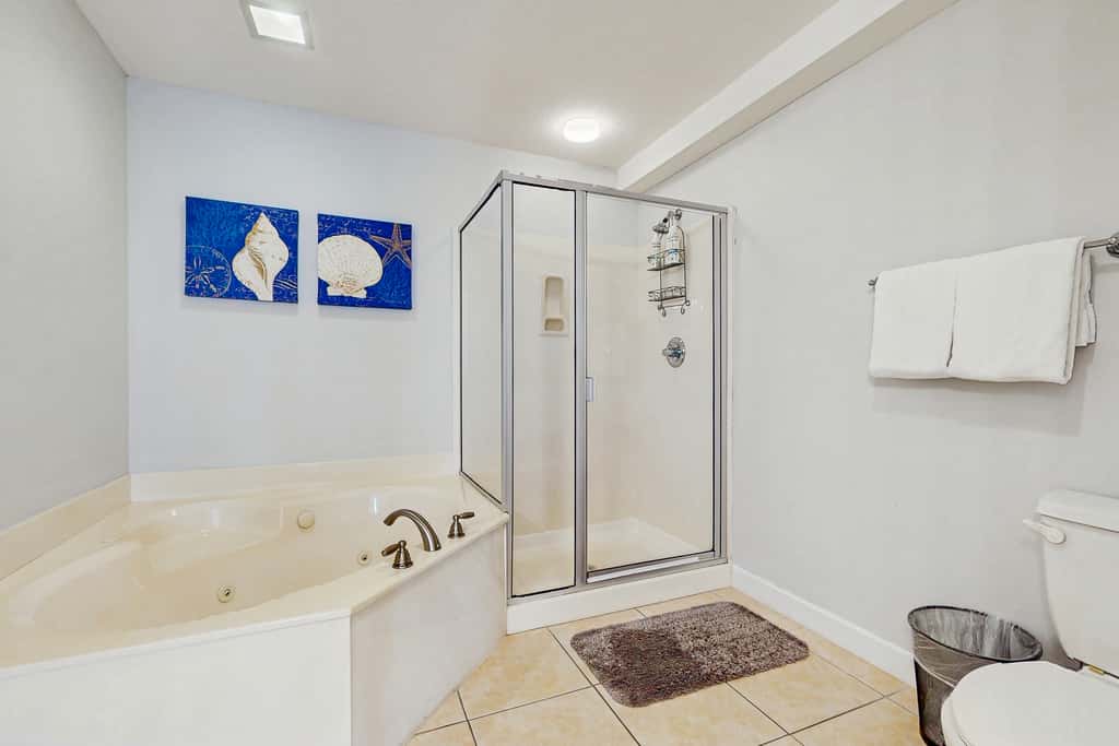 Waterfront Home Close to Beach with Shared Pool, Hot Tub, Free WiFi, & Central AC