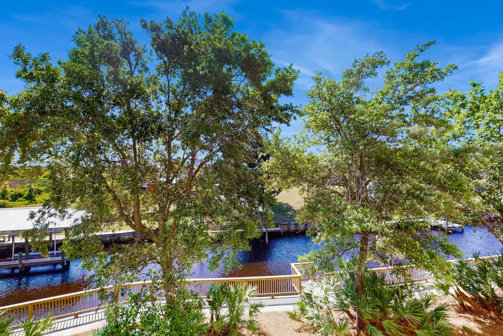 Waterfront Home Close to Beach with Shared Pool, Hot Tub, Free WiFi, & Central AC