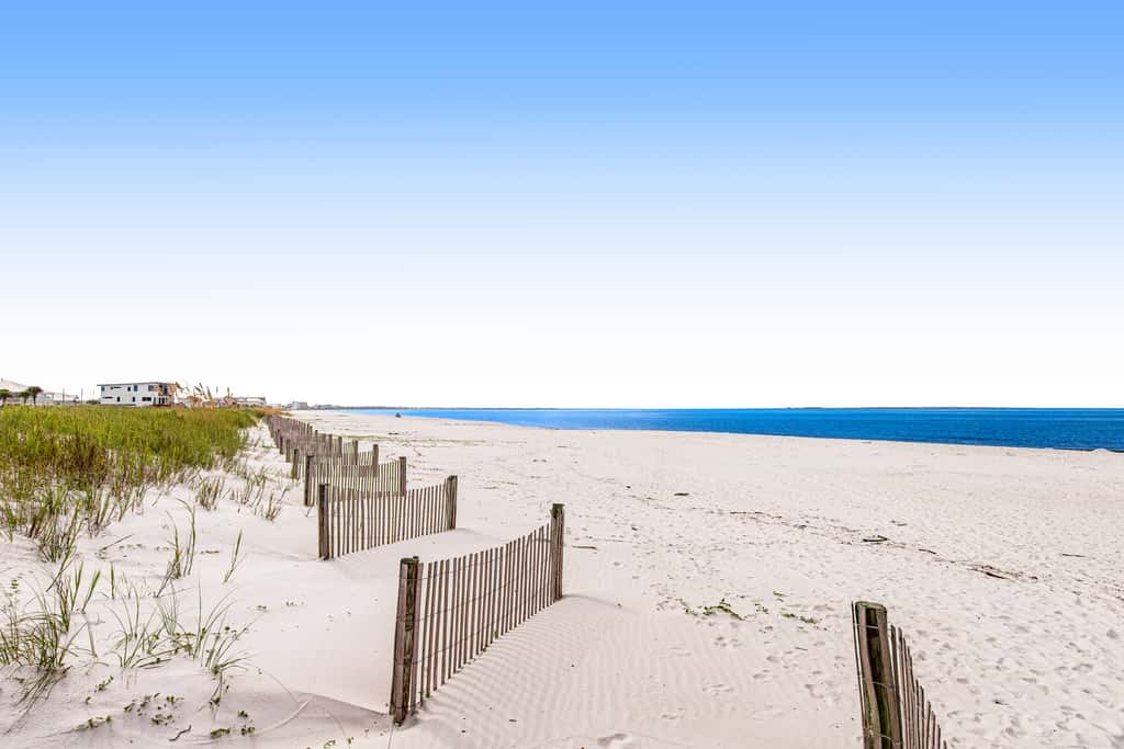 Waterfront Home Close to Beach with Shared Pool, Hot Tub, Free WiFi, & Central AC