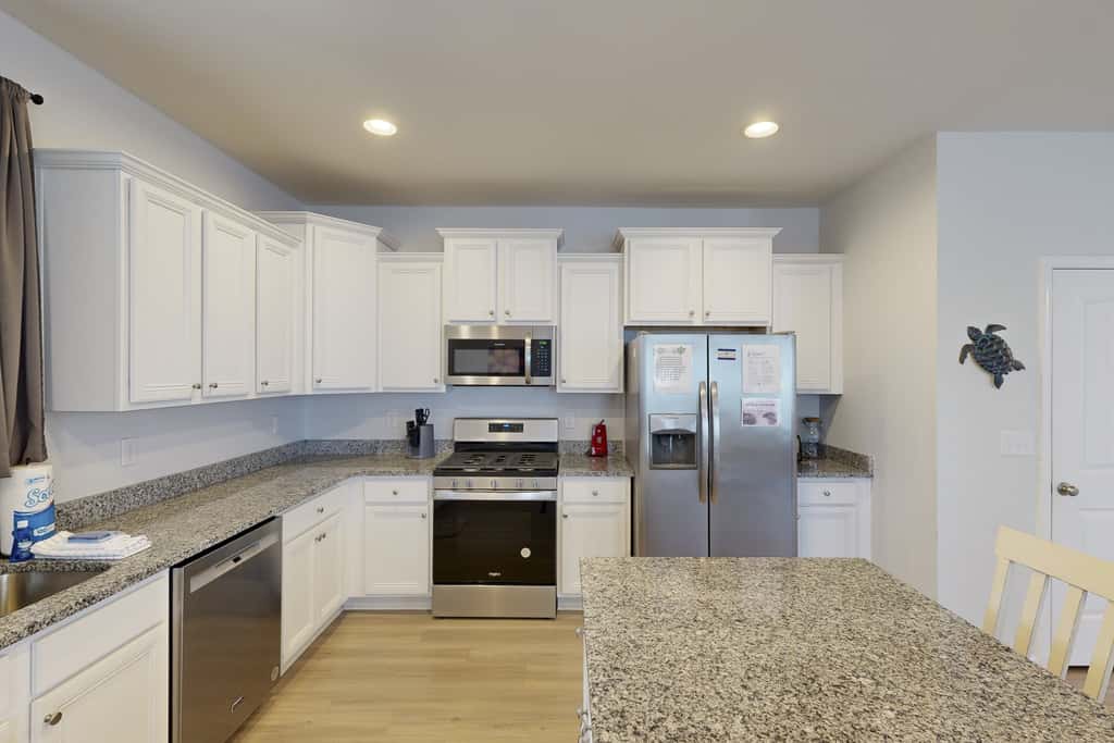 Lovely Home with Screened-In Porches, Balcony & Shared Pool - Walk to the Beach