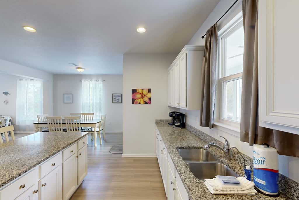 Lovely Home with Screened-In Porches, Balcony & Shared Pool - Walk to the Beach