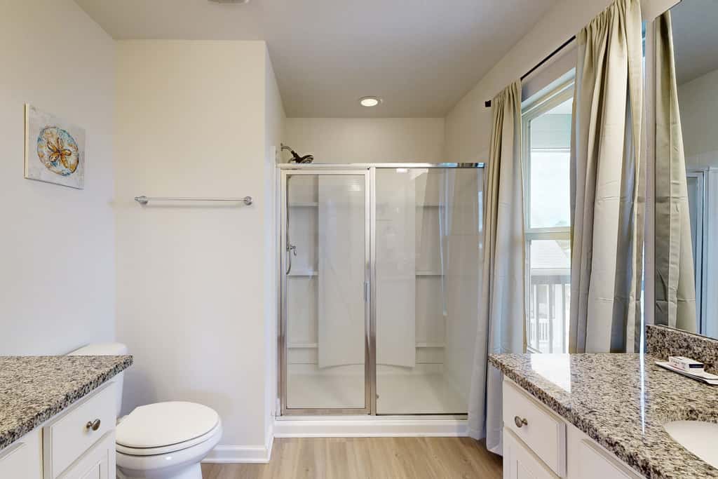 Lovely Home with Screened-In Porches, Balcony & Shared Pool - Walk to the Beach