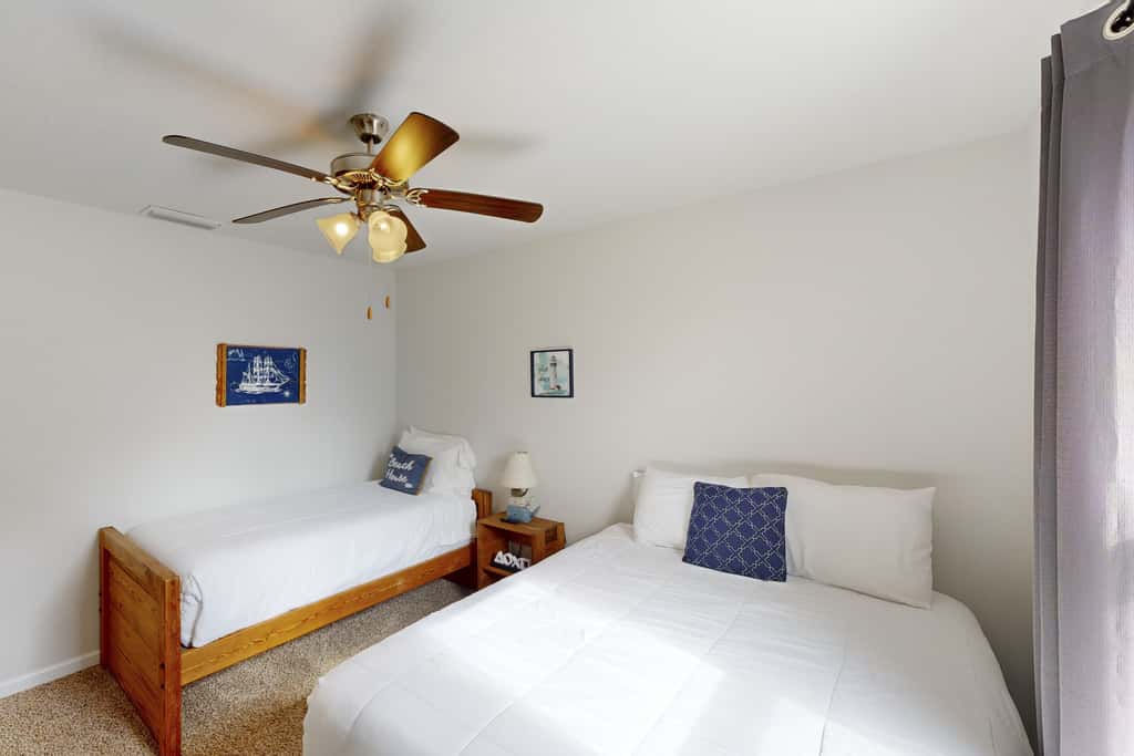 Lovely Home with Screened-In Porches, Balcony & Shared Pool - Walk to the Beach