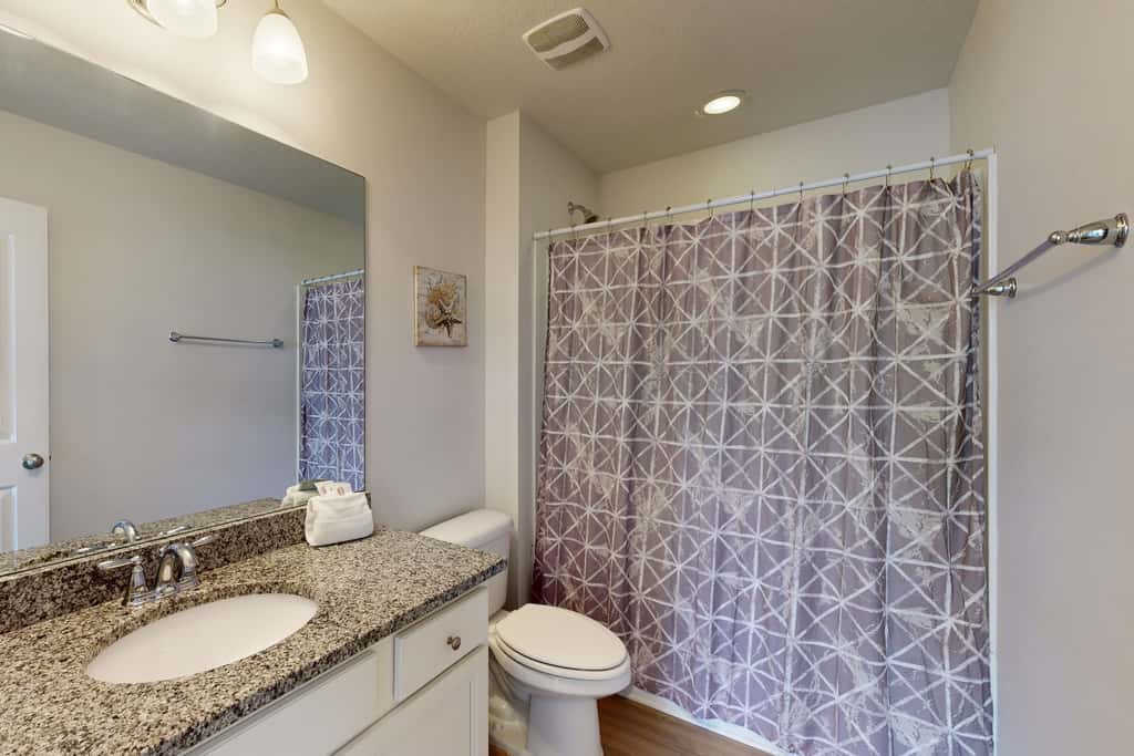 Lovely Home with Screened-In Porches, Balcony & Shared Pool - Walk to the Beach