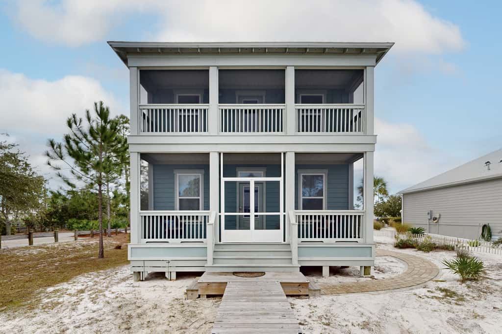 Lovely Home with Screened-In Porches, Balcony & Shared Pool - Walk to the Beach