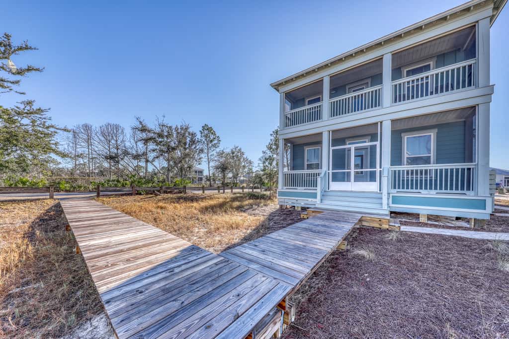 Lovely Home with Screened-In Porches, Balcony & Shared Pool - Walk to the Beach