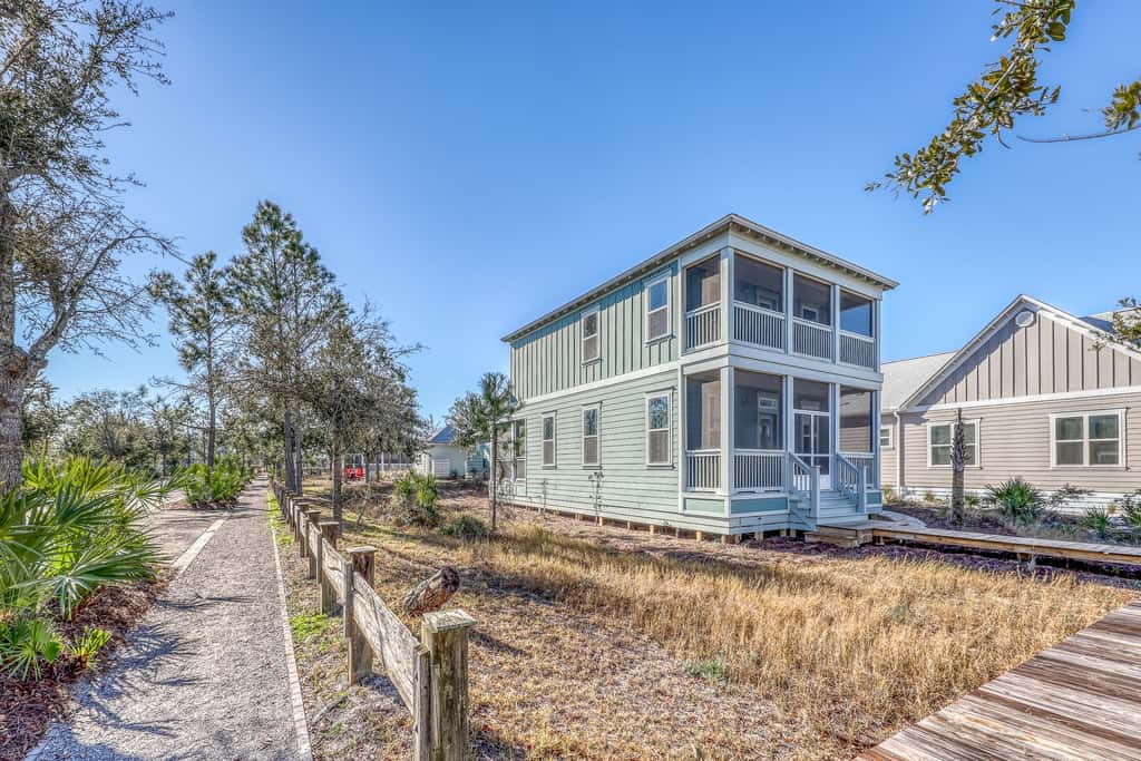 Lovely Home with Screened-In Porches, Balcony & Shared Pool - Walk to the Beach