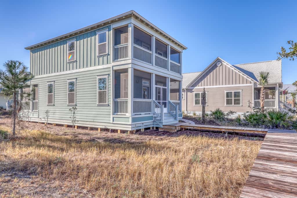 Lovely Home with Screened-In Porches, Balcony & Shared Pool - Walk to the Beach