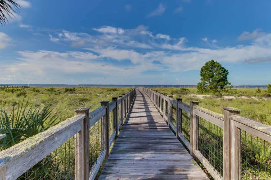 Lovely Home with Screened-In Porches, Balcony & Shared Pool - Walk to the Beach