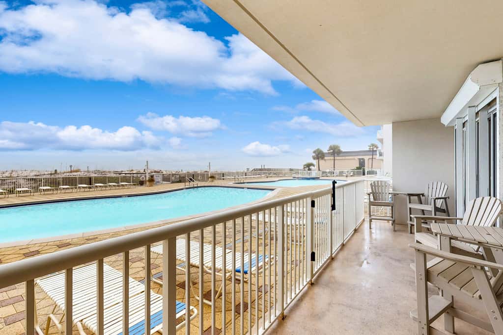 Gulf-front condo with washer/dryer, pools, hot tub, fitness room, & beach access