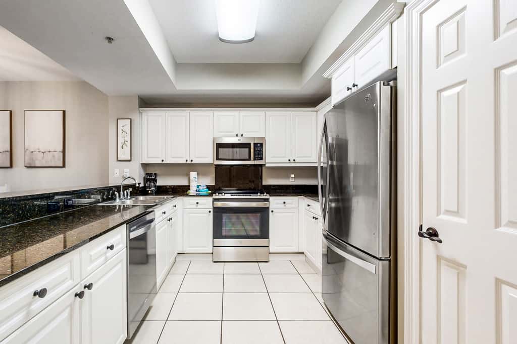 Gulf-front condo with washer/dryer, pools, hot tub, fitness room, & beach access