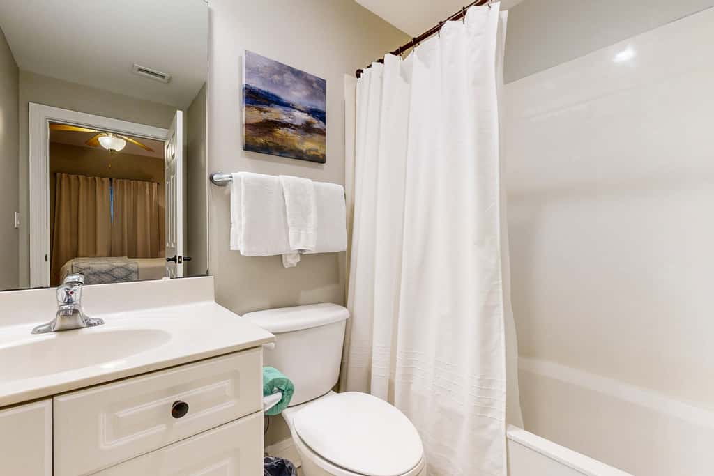 Gulf-front condo with washer/dryer, pools, hot tub, fitness room, & beach access
