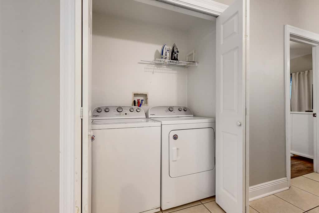 Gulf-front condo with washer/dryer, pools, hot tub, fitness room, & beach access