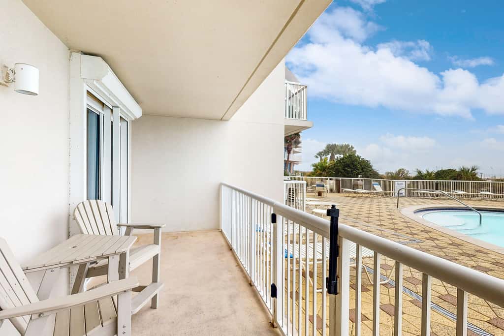 Gulf-front condo with washer/dryer, pools, hot tub, fitness room, & beach access