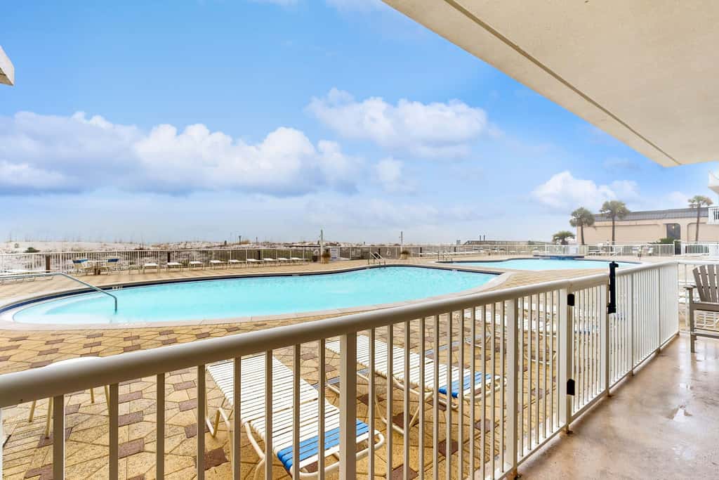 Gulf-front condo with washer/dryer, pools, hot tub, fitness room, & beach access