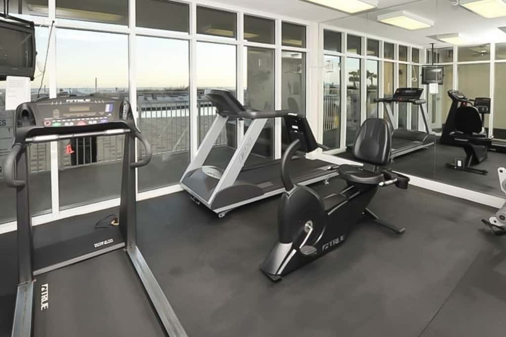 Gulf-front condo with washer/dryer, pools, hot tub, fitness room, & beach access