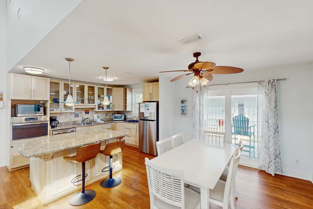 Spacious dog-friendly home with community pool, deck, & WiFi - minutes to beach