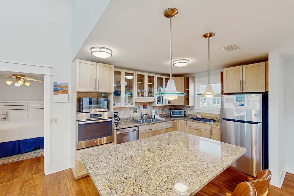 Spacious dog-friendly home with community pool, deck, & WiFi - minutes to beach